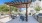 Outdoor lounge at our apartments for rent in Fort Worth, featuring outdoor tables and a shade structure.