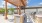 Outdoor lounge at our apartments for rent in Fort Worth, featuring a grill station and a shade structure.